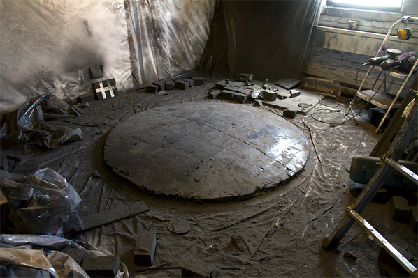 Alejandra Prieto, Studio view with Convex Coal Mirror (coal, 72 x 72 x 8 inches) on floor Alejandra Prieto, Studio view with Convex Coal Mirror (coal, 72 x 72 x 8 inches) on floor